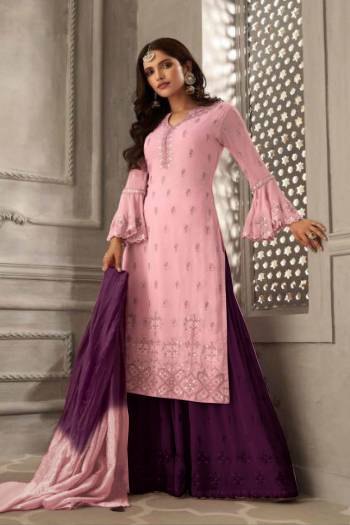 Grab This Very Beautiful Designer Sharara Suit In Pink Colored Top Paired With Contrasting Purple Colored Bottom And Shaded Purple And Pink Colored Dupatta. Its Embroidered Top Is Fabricated On Georgette Paired With Santoon Bottom And Chiffon Fabricated Dupatta. Its Pretty Color Pallete And Embroidery Will Earn You Lots Of Compliments From Onlookers. 