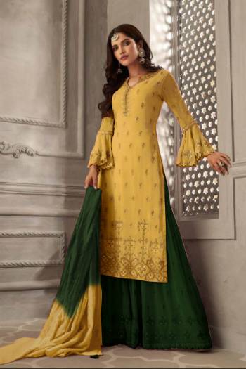 Grab This Very Beautiful Designer Sharara Suit In Yellow Colored Top Paired With Contrasting Green Colored Bottom And Shaded Green And Yellow Colored Dupatta. Its Embroidered Top Is Fabricated On Georgette Paired With Santoon Bottom And Chiffon Fabricated Dupatta. Its Pretty Color Pallete And Embroidery Will Earn You Lots Of Compliments From Onlookers. 