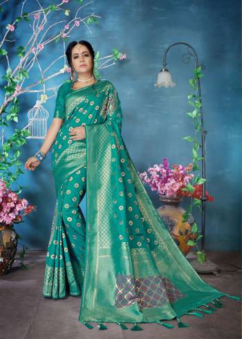 Here Is A Very Beautiful Designer Silk Based Saree In Sea Green Color Paired With Sea Green Colored Blouse. This Heavy Weaved Saree Is Fabricated On Banarasi Art Silk. It Is Rich Durable And Easy To Care For. 