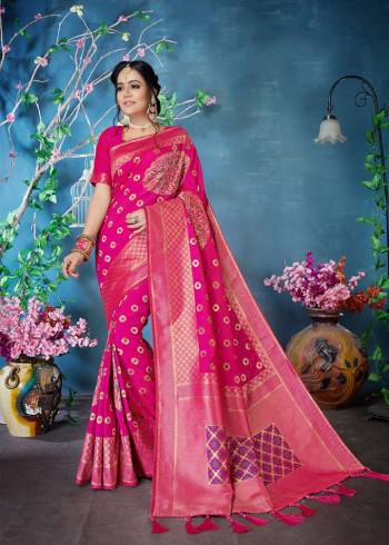 Celebrate This Festive Season Wearing This Beautiful Silk Based Saree In Rani Pink Color Paired With Rani Pink Colored Blouse. This Saree And Blouse Are Fabricated On Banarasi Art Silk Beautified With Weave All Over. 