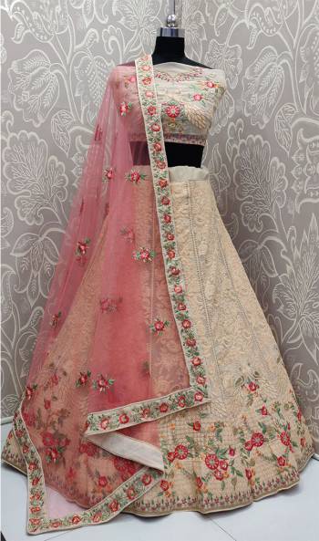 Get Ready For The Upcoming Wedding Season With This Very Beautiful And Heavy Designer Lehenga Choli In Peach Color Paired With Contrasting Pink Colored Dupatta. Its Blouse And Lehenga Are Georgette Based Paired With net Fabricated Dupatta. It IS Beautified With Heavy Lakhnavi Embroidery. 