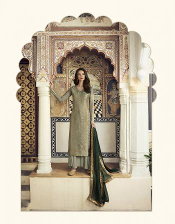 Flaunt Your Rich And Elegant Taste Wearing This Designer Straight Suit In Pastel Green Color Paired With Dark Green Colored Dupatta. Its Top Is Fabricated On Jacquard Silk Paired With Santoon Bottom And Georgette Fabricated Dupatta. it is Beautified With Weave And Attractive Stone Work. 