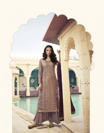 Lovely Shade Is Here With This Designer Straight Suit In Mauve Color Paired With Purple Colored Dupatta. Its Pretty Weaved Top Is Fabricated On Jacquard Silk Paired With Santoon Bottom and Georegtte Fabricated Stone Work Dupatta. 