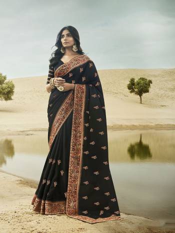 For A Bold And Beautiful Look, Grab This Very Beautiful And Heavy Designer Saree In Black Color Paired With Black Colored Blouse. This Saree And Blouse Are Silk Based Beautified With Attractive Embroidery. 