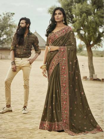 You Will Definitely Earn Lots Of Compliments Wearing This Heavy Designer Saree In Dark Olive Green Color. This Silk Based Saree Is Beautified With Attractive Embroidery. Its Rich English Color and Attractive Embroidery Will Earn You Lots Of Compliments From Onlookers.