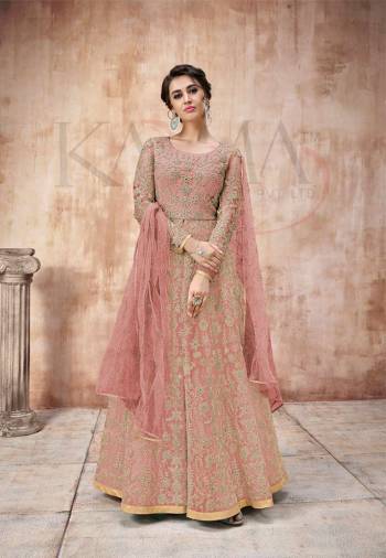 Add This Very Pretty Heavy Designer Floor Length Suit To Your Wardrobe In All Over Pink Color. Its Heavy Embroidered Top IS Fabricated On Net Paired With Satin Silk Bottom And Net Fabricated Dupatta. It Is Light In Weight And Easy To Carry Throughout The Gala. Buy Now.