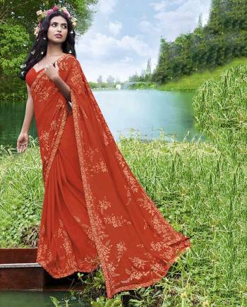 Grab This Very Beautiful And Elegant Looking Designer Saree In Orange Color Paired With Orange Colored Blouse. This Saree Is Fabricated On Georgette Paired With Art Silk Fabricated Blouse. This Saree Is Light In Weight And Easy To Carry All Day Long. 