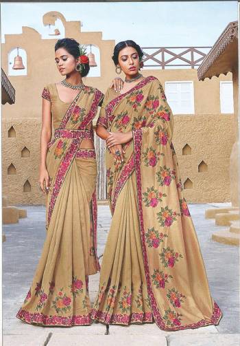 You Will Definitely Earn Lots Of Compliments Wearing This Designer Silk Based Saree In Rich Beige Color Paired With Beige Colored Blouse. It Is Beautified With Contrasting Thread Embroidered Motifs. 