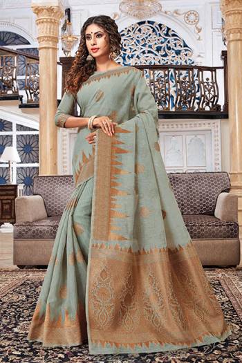 Add This Lovely Saree To Your Wardrobe In Grey Color Fabricated On Cotton Silk. Its Pretty Color And Rich Fabric Will Earn You Lots Of Compliments From Onlookers. 