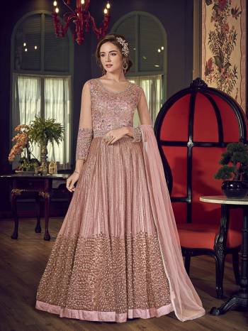 You Will Definitely Earn Lots Of Compliments Wearing This Heavy Designer Floor Length Suit In Baby Pink Color. Its Heavy Embroidered Top Is Fabricated On Net Paired With Santoon Bottom And Chiffon Fabricated Dupatta. 