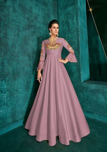 Celebrate This Festive Season Wearing This Designer Readymade Gown In Mauve Pink Color Fabricated On Soft Art Silk Beautified With Embroidery. Its Rich Fabric And Color Will Definitely Earn You Lots Of Compliments From Onlookers.?