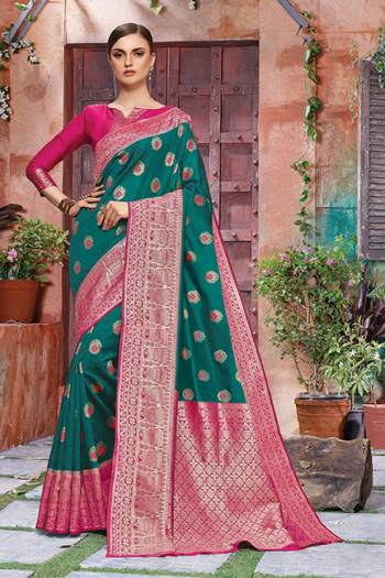 You Will Definitely Earn Lots Of Compliments In Traditional Look?Wearing This Beautiful Silk Based Saree In Teal Green And Dark Pink Color. This Saree Is Light Weight, Durable And Easy To Carry All Day Long.