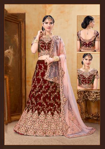 Be The Prettiest Bride Wearing This Very Beautiful And Heavy Embroidered Designer Bridal Lehenga Choli In Maroon Color Paired With Contrasting Baby Pink Colored Dupatta. This Lehenga Choli Is Velvet Based Paired With Net Fabricated Dupatta. Buy This Beautiful Lehenga Choli Now