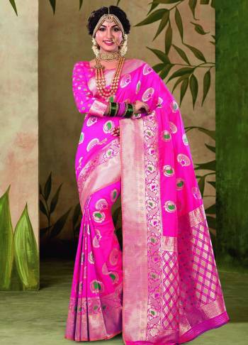 Shine Bright Wearing This LovelySilk Based Saree In Rani Pink Color. This Saree And Blouse are Fabricated On Satin Silk Beautified With Weave All Over. 