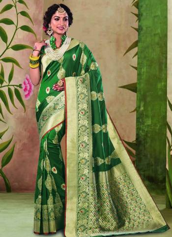 For A Royal Look, Grab This Lovely Silk Based Saree In Dark Green Color.?This Saree And Blouse are Fabricated On Satin Silk Beautified With Weave All Over