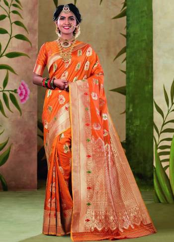 Add This Lovely Saree To Your Wardrobe In Orange Color Fabricated On Satin Silk. Its Pretty Color And Rich Fabric Will Earn You Lots Of Compliments From Onlookers