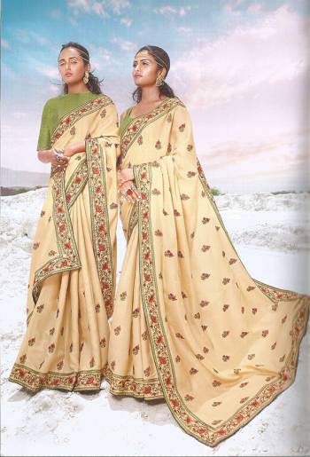 Simple And Elegant Looking Designer Saree Is Here In Cream Color Paired With Light Green Colored Blouse. It Has Pretty Contrasting Thread Embroidery Over The Saree Border And Butti.