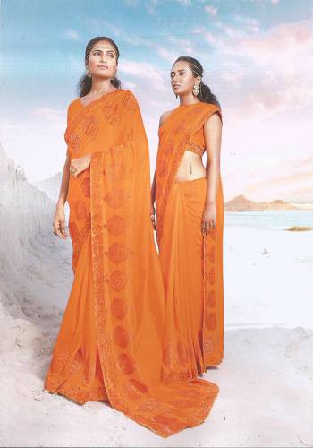 Here Is A Very Pretty Designer Saree In Orange Color Paired With Orange Colored Blouse. This Saree And Blouse are silk Based Beautified With Tone To Tone Embroidery. 