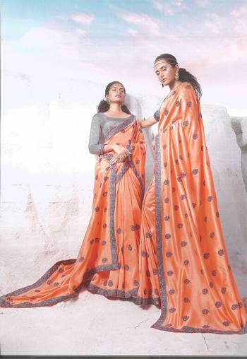 Simple And Elegant Looking Designer Saree Is Here In Orange Color Paired With Grey Colored Blouse. It Has Pretty Contrasting Thread Embroidery Over The Saree Border And Butti.