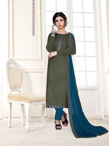 For Your Semi-Casual Wear, Grab This Pretty Dress Material In Olive Green Color Paired With Contrasting Blue Colored Bottom And Dupatta. Its Top Is Fabricated On Cotton Slub Paired With Cotton Bottom And Chiffon Fabricated Dupatta. 