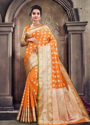 Celebrate This Festive Season Wearing This Saree In Orange Color Paired With Orange Colored Blouse. This Saree And Blouse Are Satin Silk Based Beautified With Weave. 