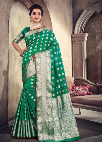 For A Proper Traditional Look, Grab This Lovely Saree In Green Color Paired With Green Colored Blouse. This Saree Is Fabricated On Satin Silk Which Is Light Weight , Durable And Easy To Carry All Day Long. 