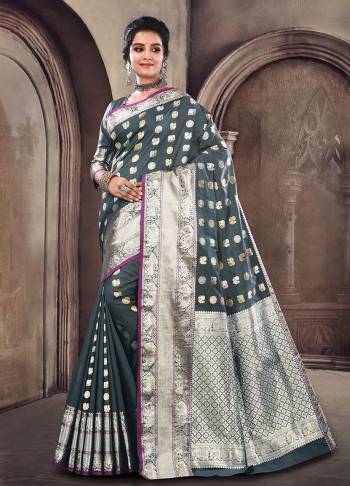 Enhance Your Personality Wearing This Designer Silk Based Saree In Dark Grey Color Paired With Dark Grey Colored Blouse. This Saree And Blouse Are Satin Silk Based Beautified With Small Tribal Weave All Over. 