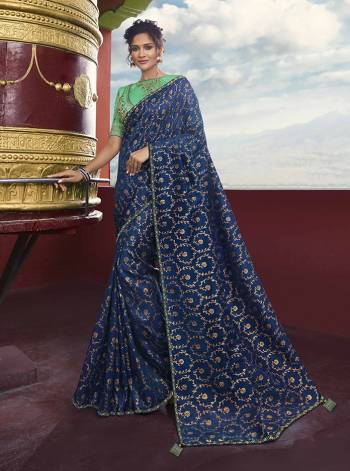 You Will Definitely Earn Lots Of Compliments Wearing This Heavy Weaved Designer Saree In Blue Color Paired With Contrasting Sea Green Colored Blouse. This Saree Is Fabricated On Weaving Art Silk Paired With Art Silk Fabricated Blouse. 