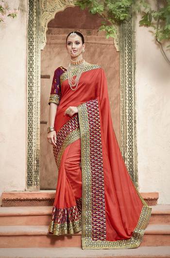 Here Is A Very Beautiful Designer Saree In Red Color Paired With Purple Colored Blouse. This Saree And Blouse Are Silk Based Beautified With Attractive Embroidery All Over. 