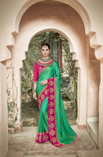 Grab This Very Beautiful And Attractive Looking Heavy Designer Saree In Sea Green Color Paired With Contrasting Rani Pink Colored Blouse. This Saree And Blouse Are Fabricated On Art Silk Which Gives A Rich Look To Your Personality. 