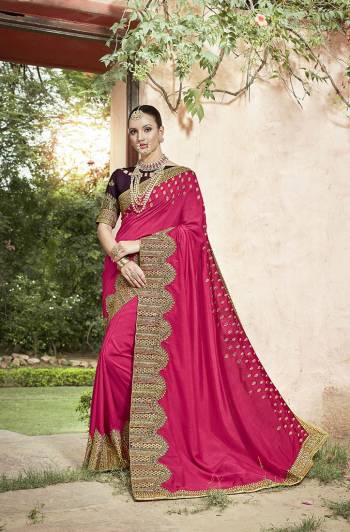 Catch All The Limelight At The Next Wedding You Attend Wearing This Designer Saree In Dark Pink Color Paired With Contrasting Wine Colored Blouse. Its Attractive Embroidered Lace Border Gives An Enhanced Look To Your Personality. 