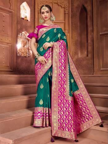 Enhance Your Personality Wearing This Teal Green Colored Saree Paired With Contrasting Rani Pink Colored Blouse .This Saree And Blouse Are Silk Based Which Gives A Rich Look To Your Personality. 