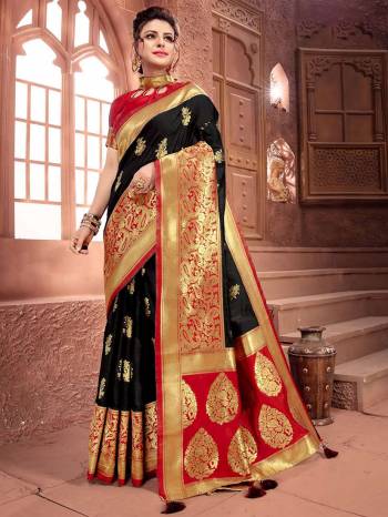 For A Bold And Beautiful Look Here Is A Saree In Black Color Paired With Red Colored Blouse. This Saree And Blouse Are Fabricated On Art Silk Which Also Gives A Rich Look To Your Personality. 