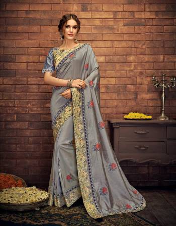 Look subtle and appealing in this basic grey saree enriched with floral print and delicate embroidered details for you next festive soiree. 