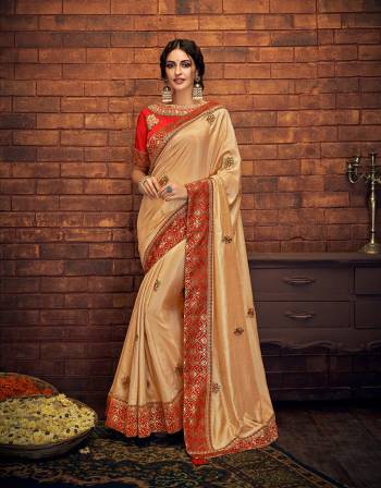 This precious Beige and red saree is a timeless piece to own. Savour it on your special day and treasure the look for years to come. 