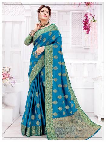 Celebrate This Festive Season With Beauty And Comfort Wearing This Pretty Saree In Blue Color, This Silk Based Saree Is Light In Weight, Durable And Easy To Carry All Day Long. 