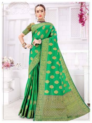 Celebrate This Festive Season With Beauty And Comfort Wearing This Pretty Saree In Green Color, This Silk Based Saree Is Light In Weight, Durable And Easy To Carry All Day Long. 