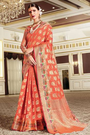 You Will Definitely Earn Lots Of Compliments In Traditional Look Wearing This Beautiful Silk Based Saree In Orange Color. This Saree Is Light Weight, Durable And Easy To Carry All Day Long