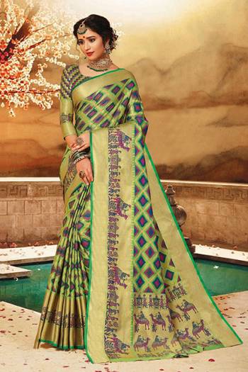 Here Is A Rich Silk Based Saree In Green Color. This Pretty Saree And Blouse Are Fabricated On Art Silk bEautified With Detailed Weave All Over It. Buy This Saree For Upcoming Festive And Wedding Season. 