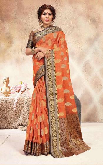 Celebrate This Festive Season In This Rich Silk Based Saree In Orange Color Paired With Contrasting Brown Colored Blouse. This Saree Is Fabricated On Chanderi Silk Paired With Jacquard Silk Fabricated Blouse. 