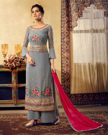 Flaunt Your Rich and Elegant Taste Wearing This Heavy Designer Suit In Grey Color Paired With Contrasting Dark Pink Colored Dupatta. Its Top Is Georgette Based Paired With Santoon Bottom And Chiffon Fabricated Dupatta. Buy Now.