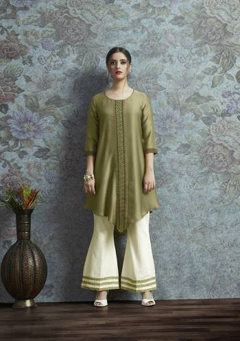 Here Is New And Unqiue With This Designer Semi-Stitched Kurti With Bottom In Indo-Western Wear. Its Pretty Modal Satin Fabricated Kurti Is In Olive Green Color Paired With Off-White Colored Unstitched Cotton Fabricated Bottom. 