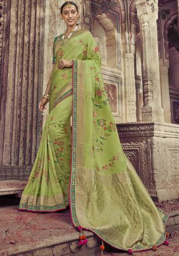 Go With The Shades Of Green Wearing This Saree In Light Green Color Paired With Green Color Blouse. This Saree And Blouse Are Fabricated On Dola Art Silk Beautified With Weaving And Attractive Embroidery. Buy This Pretty Saree Now.