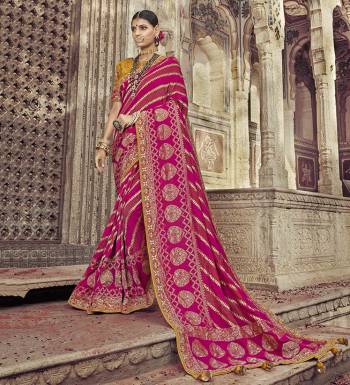 You Will Definitely Earn Lots Of Compliments Wearing This Designer Saree In Dark Pink Color Paired With Contrasting Musturd Yellow Colored Blouse. This Saree And Blouse Are Rich Silk Based Beautified With Weave And Attractive Embroidery. 