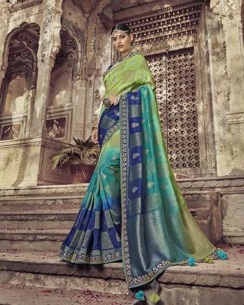 Shades Can Never Go Out Of Style, So Grab This Very Beautiful And Attractive Looking Shaded Saree In Green And Blue Color Paired With Royal Blue Colored Blouse. This Saree And Blouse Are Dola Art Silk Fabricated Which Also Gives a rich Look To Your Personality. 