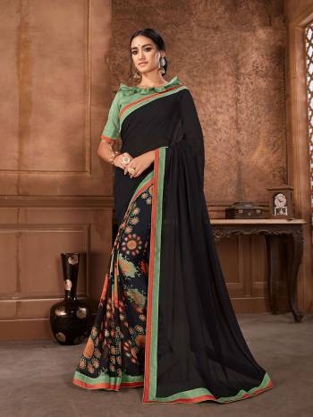 For Your Semi-Casuals, Grab This Printed Saree In Black Color Paired With Green Colored Blouse. This Saree Is Fabricated On Georgette Paired With Art Silk Fabricated Blouse. It Is Light Weight And Easy To Carry All Day Long. 