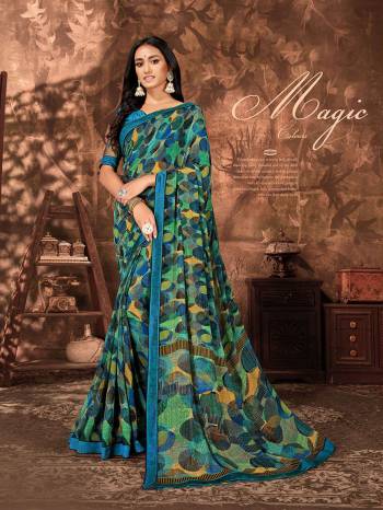 For Your Semi-Casuals, Grab This Printed Saree In Green And Blue Color Paired With Blue Colored Blouse. This Saree Is Fabricated On Georgette Paired With Art Silk Fabricated Blouse. It Is Light Weight And Easy To Carry All Day Long. 