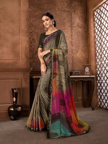 Enhance Your Personality Wearing This Pretty Saree In Brown And Multi Color Paired With Brown Colored Blouse .This Saree Is Georgette Based Paired With Art Silk Fabricated Blouse. Its Fabric Is Light Weight And Easy To Carry All Day Long. 