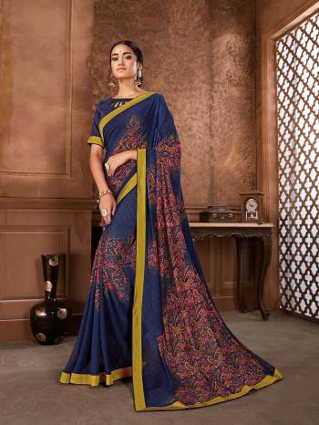 For Your Semi-Casuals, Grab This Printed Saree In Blue Color Paired With Blue Colored Blouse. This Saree Is Fabricated On Georgette Paired With Art Silk Fabricated Blouse. It Is Light Weight And Easy To Carry All Day Long. 