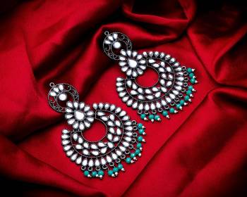 Grab These Beautiful Pair Of Earrings In Silver Color Beautified With Stone And Pearl Work. You Can Pair This Up With Any Kind Of Kurti, Suit Or Lehenga. Buy Now.